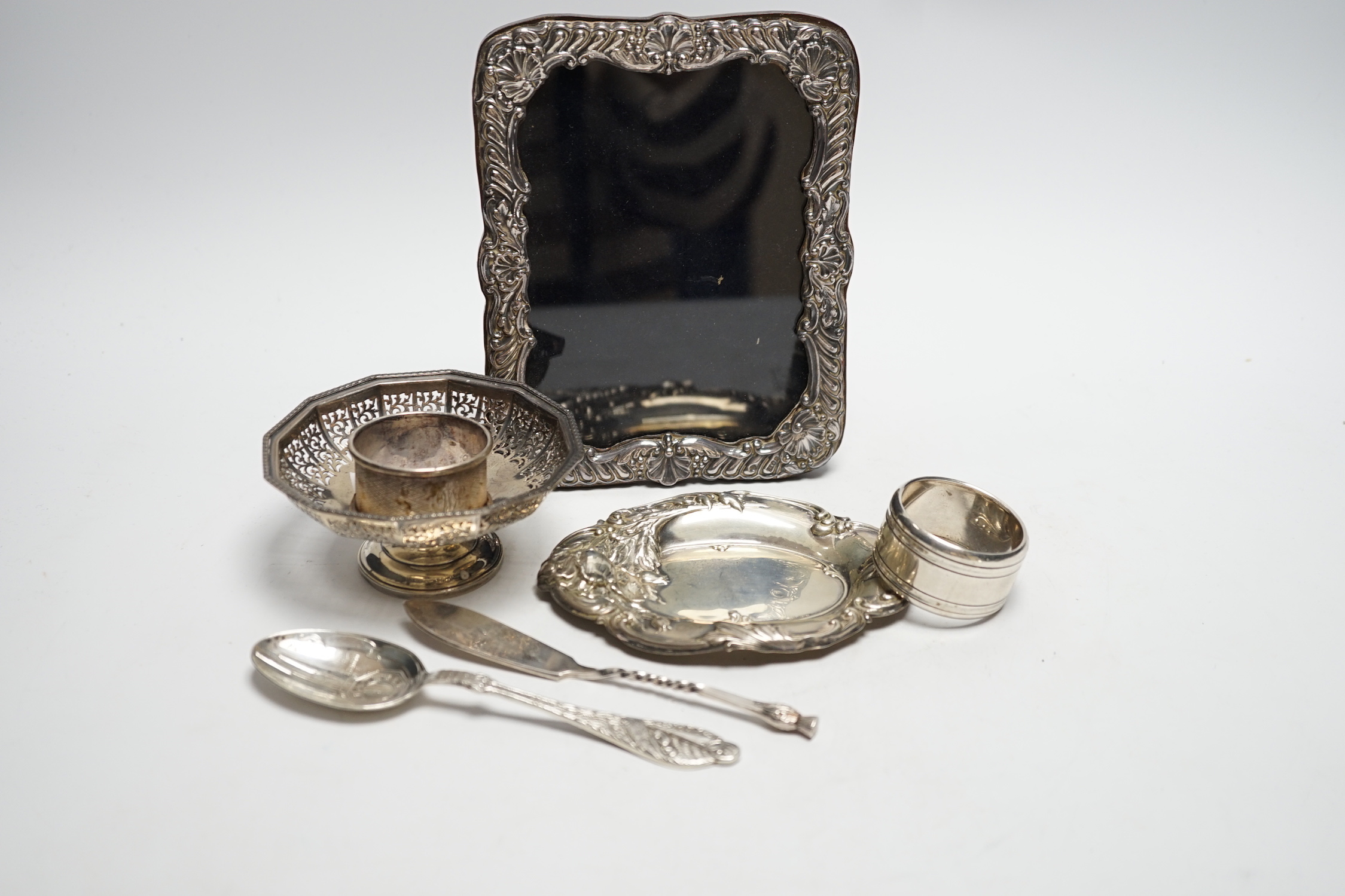 Sundry small silver and plate including a mounted photograph frame, napkin ring bonbon dish, plated butter knife, etc.